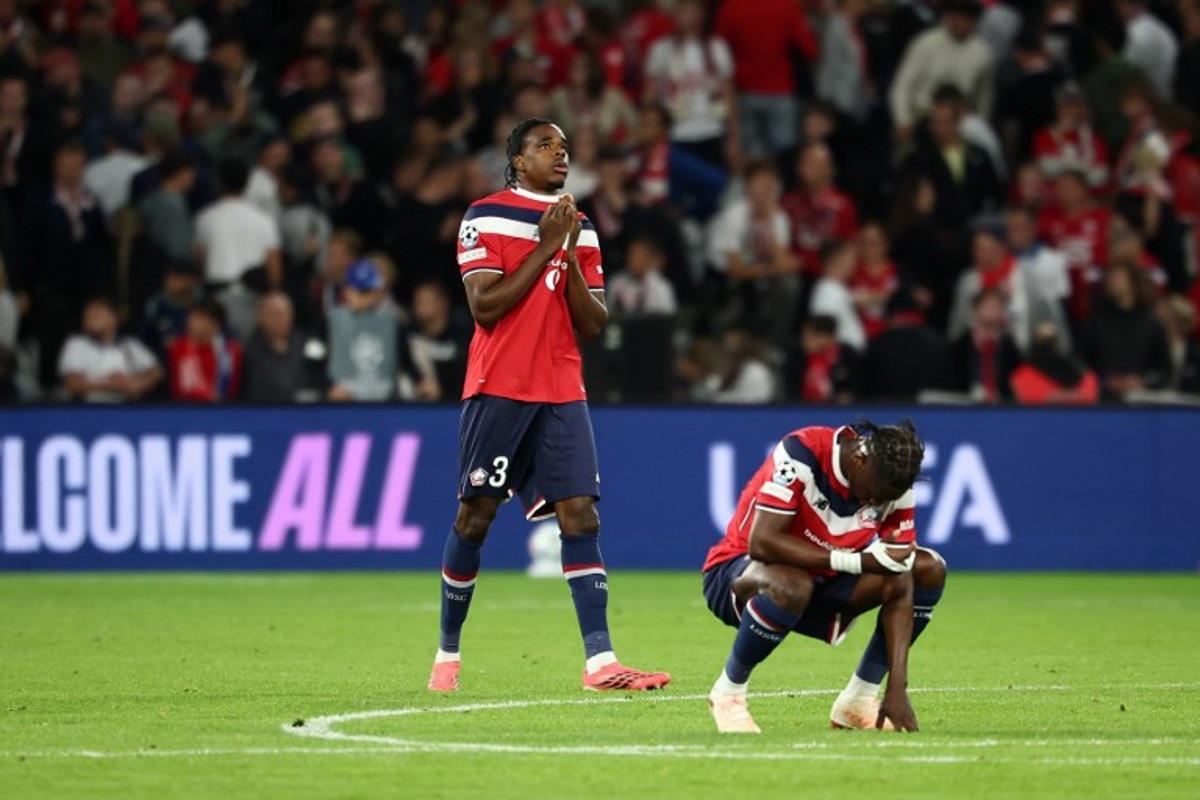 Lille's Brazilian defender #04 Alexsandro (R) and Lille's Belgian defender #03 Nathan Ngoy (L) react at the end of the UEFA Champions League, league phase day 1, football match between Lille (FRA) and Real Betis (ESP) at the Stade Pierre Mauroy, in Villeneuve d'Ascq, on September 8, 2026. Sameer AL-DOUMY / AFP