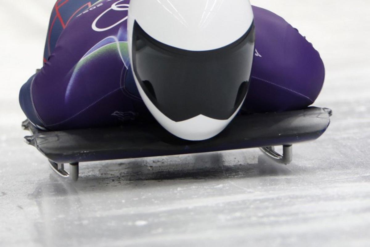 Britain's Matt Weston competes in the skeleton men's heat 1 at Cortina Sliding Centre during the Milano Cortina 2026 Winter Olympic Games in Cortina d'Ampezzo on February 12, 2026. Odd ANDERSEN / AFP