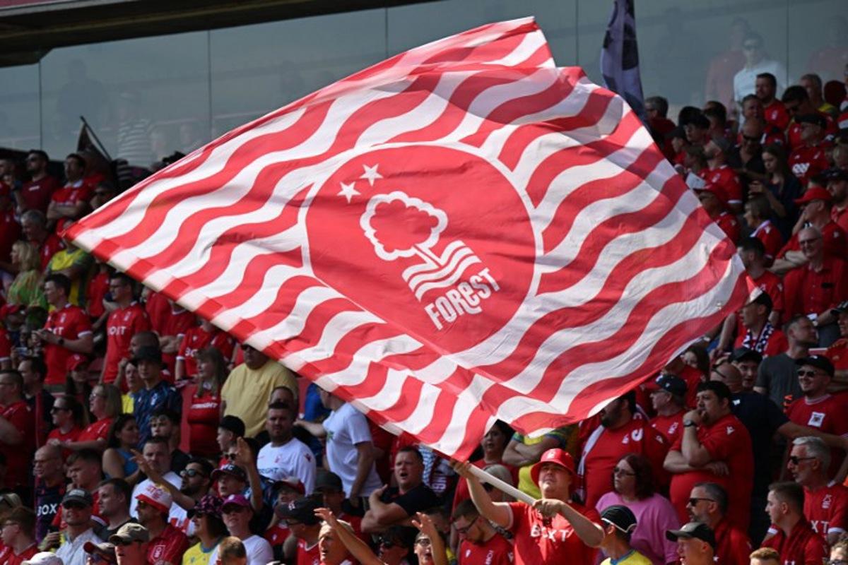 A Forest flag is waved ahead of the English Premier League football match between Nottingham Forest and West Ham United at The City Ground in Nottingham, central England, on August 14, 2022. Paul ELLIS / AFP
