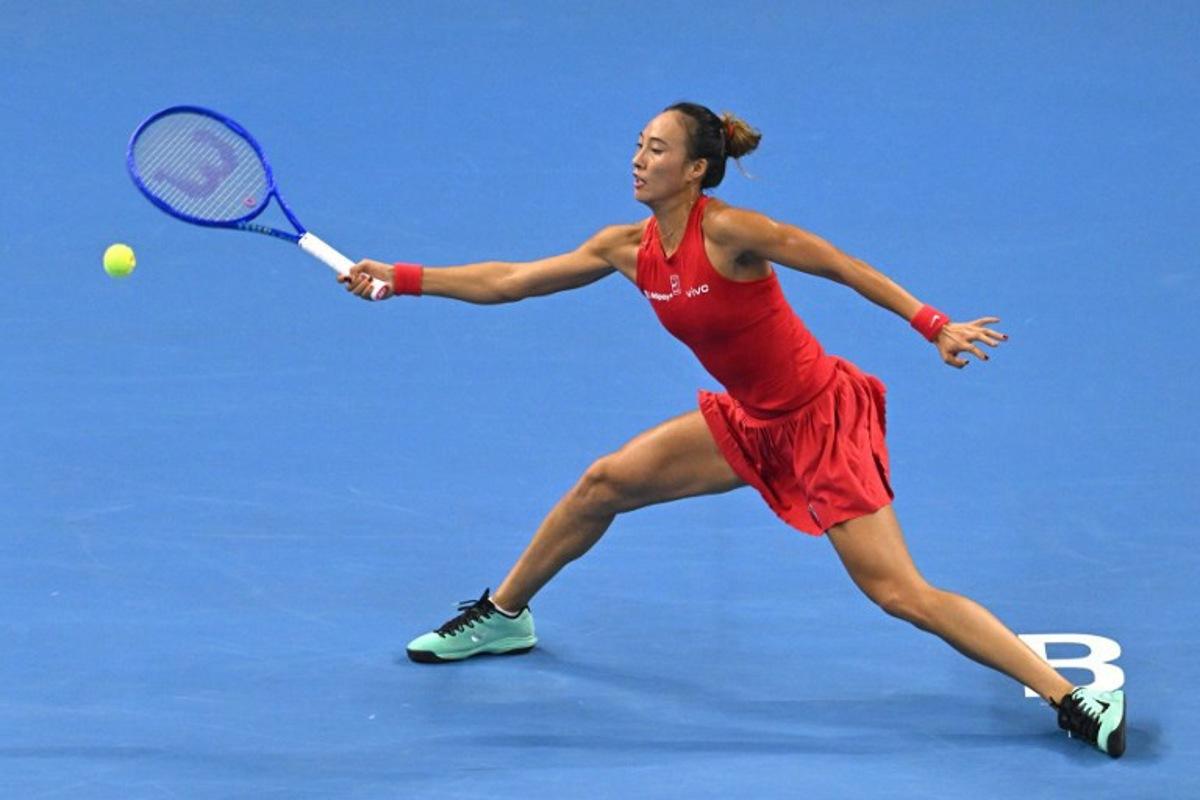 China's Zheng Qinwen hits a return to Russia's Mirra Andreeva during their women's singles quarter-final at the China Open tennis tournament in Beijing on October 11, 2026. Greg Baker / AFP