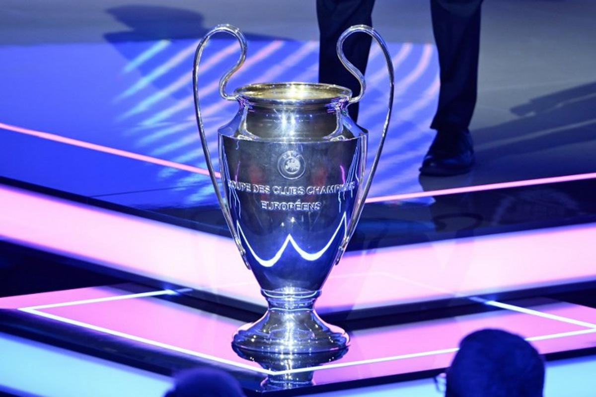 This photograph shows the UEFA Champions League trophy, before the draw for the group stage of the 2025-2026 UEFA Champions League football tournament, at the Grimaldi Forum in Monaco on August 28, 2025. Frederic DIDES / AFP