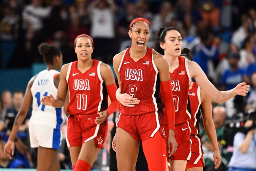 (From L) USA's #11 Napheesa Collier, USA's #09 A'ja Wilson and USA's #10 Breanna Stewart react in the women's Gold Medal basketball match between France and the USA during the Paris 2024 Olympic Games at the Bercy Arena in Paris on August 11, 2024. Aris MESSINIS / AFP