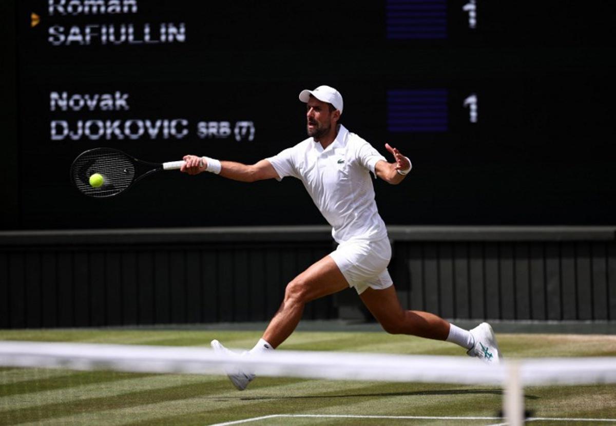 Serbia's Novak Djokovic returns to Russia's Roman Safiullin during their men's singles round of 16 tennis match on the seventh day of the 2026 Wimbledon Championships at The All England Lawn Tennis and Croquet Club in Wimbledon, southwest London, on July 5, 2026. Henry Nicholls / AFP