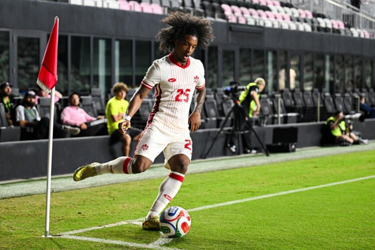 Canada's forward #25 Jayden Nelson takes a corner kick during the international friendly football match between Canada and Venezuela at Chase Stadium in Fort Lauderdale, Florida, on November 18, 2025. CHANDAN KHANNA / AFP
