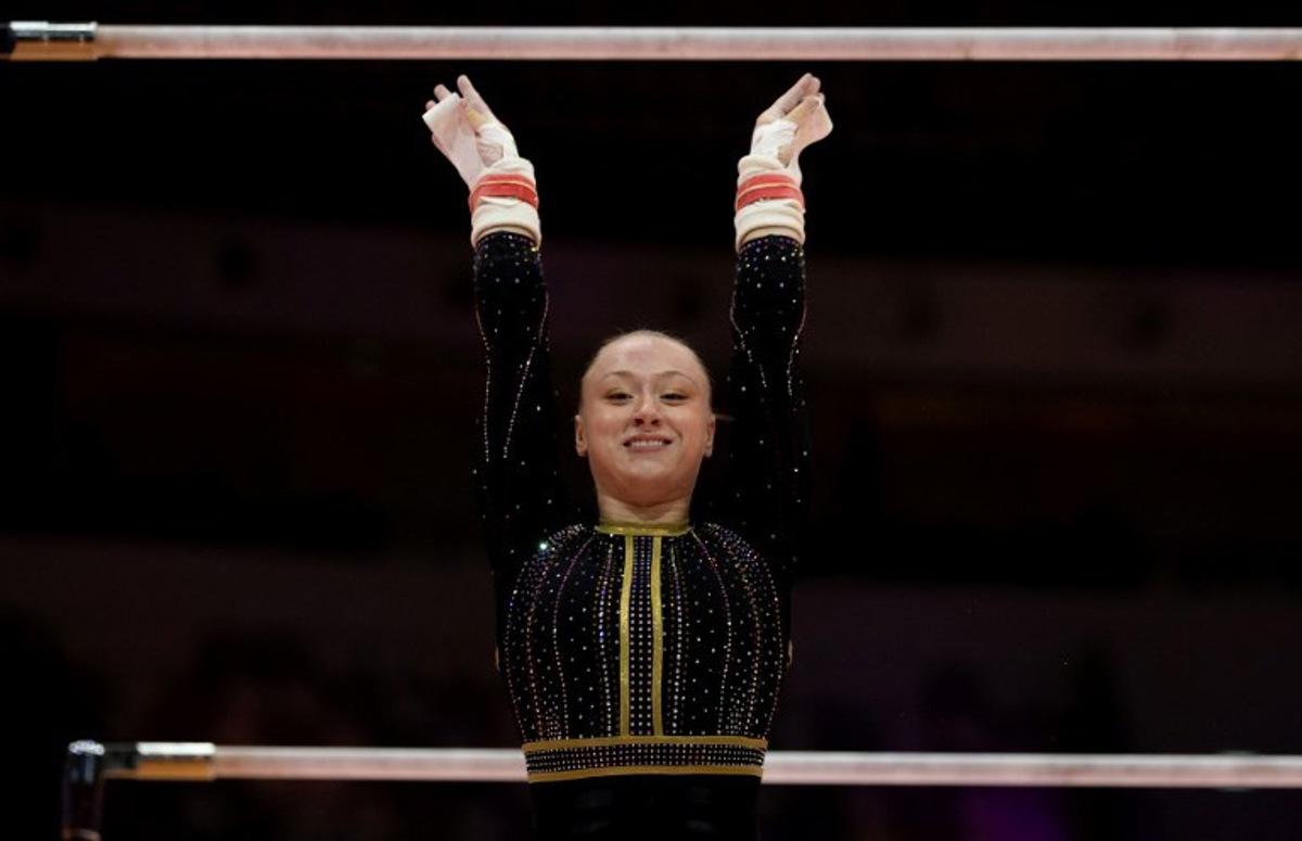 Belgium's Lisa Vaelen competes on the uneven bars during the women's qualifying session at the 53rd FIG Artistic Gymnastics World Championships in Jakarta on October 21, 2025. Yasuyoshi CHIBA / AFP