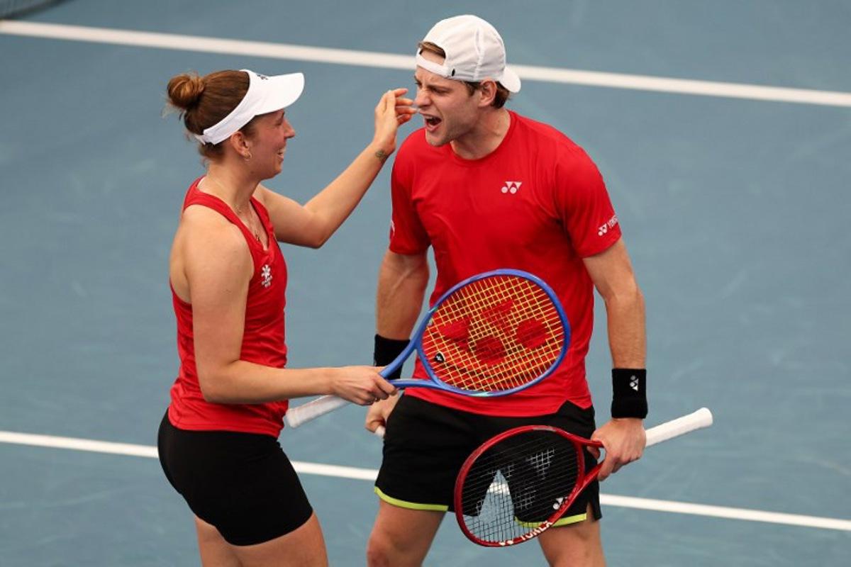 Belgium's Zizou Bergs (R) and Elise Mertens celebrate after winning their mixed double games against Canada's Cleeve Harper and Victoria Mboko at the United Cup tennis tournament on Ken Rosewall Arena in Sydney on January 6, 2026. Izhar KHAN / AFP