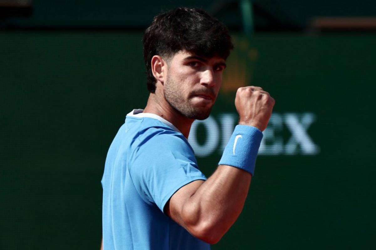 Spain's Carlos Alcaraz celebrates a point against Monaco's Valentin Vacherot during the Monte Carlo ATP Masters Series Tournament semi-final tennis match on Court Rainier III at the Monte-Carlo Country Club in Roquebrune-Cap-Martin, south-eastern France on April 11, 2026. Thibaud MORITZ / AFP
