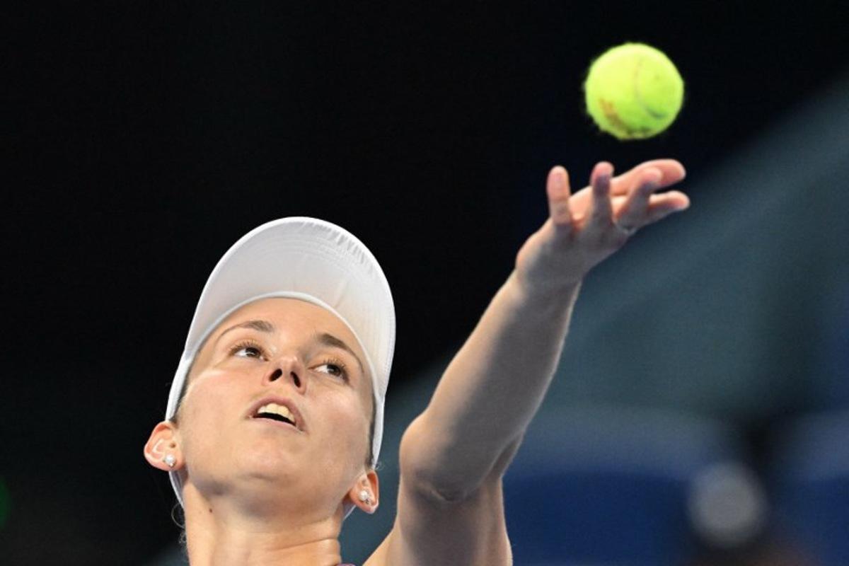 Belgium's Elise Mertens hits a return to Poland's Iga Swiatek during their women's singles quarter-final at the China Open tennis tournament in Beijing on October 9, 2026. Greg Baker / AFP