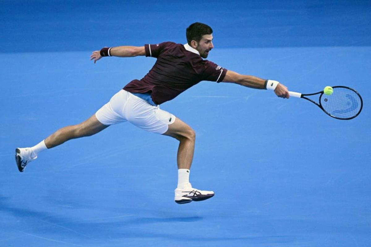 Serbia's Novak Djokovic hits a return to Russia's Daniil Medvedev during their men's singles semi-final match at the China Open tennis tournament in Beijing on October 5, 2026. ADEK BERRY / AFP