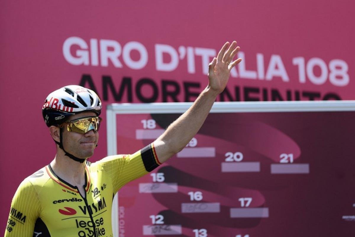 Team Visma-Lease a Bike's Belgian rider Wout Van Aert waves before the start of the 18th stage of the 108th Giro d'Italia cycling race of 144kms from Morbegno to Cesano Maderno on May 29, 2025. Luca Bettini / AFP