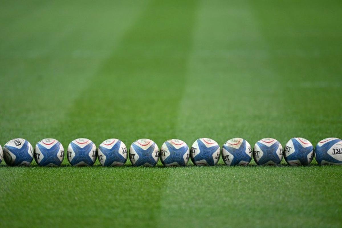 A picture shows rugby ball on the pitch of the Friuli stadium before the Autumn Nations Series international rugby union match between Italy and Australia (wallabies) in Udine on November 8, 2025. Stefano RELLANDINI / AFP