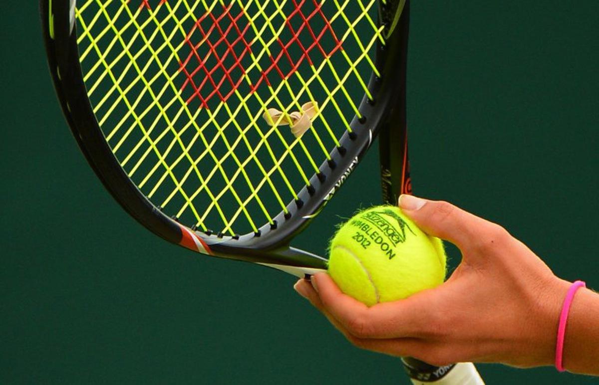 Russia's Maria Kirilenko prepares to serve during her second round women's singles match on day three of the 2012 Wimbledon Championships tennis tournament at the All England Tennis Club in Wimbledon, southwest London, on June 27, 2012. AFP PHOTO / MIGUEL MEDINA RESTRICTED TO EDITORIAL USE MIGUEL MEDINA / AFP