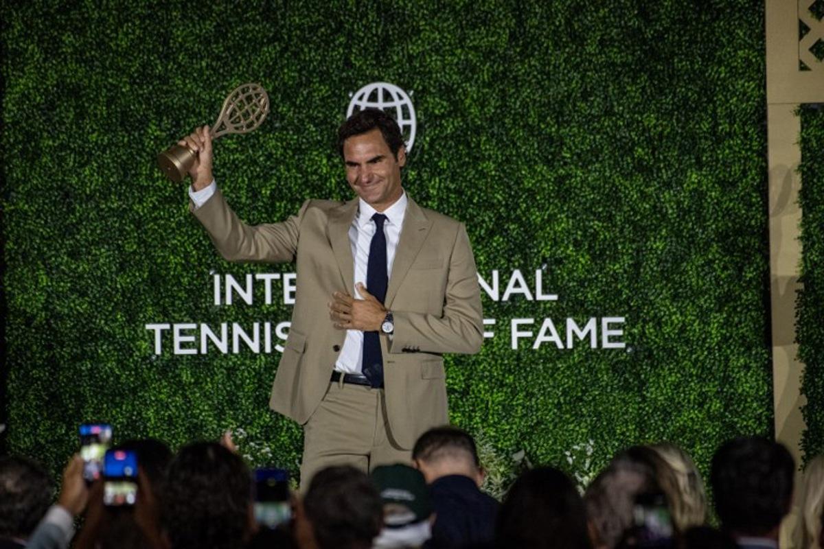 Swiss former tennis player Roger Federer accepts his induction into the International Tennis Hall of Fame during a ceremony in Newport, Rhode Island, on August 29, 2026. Joseph Prezioso / AFP