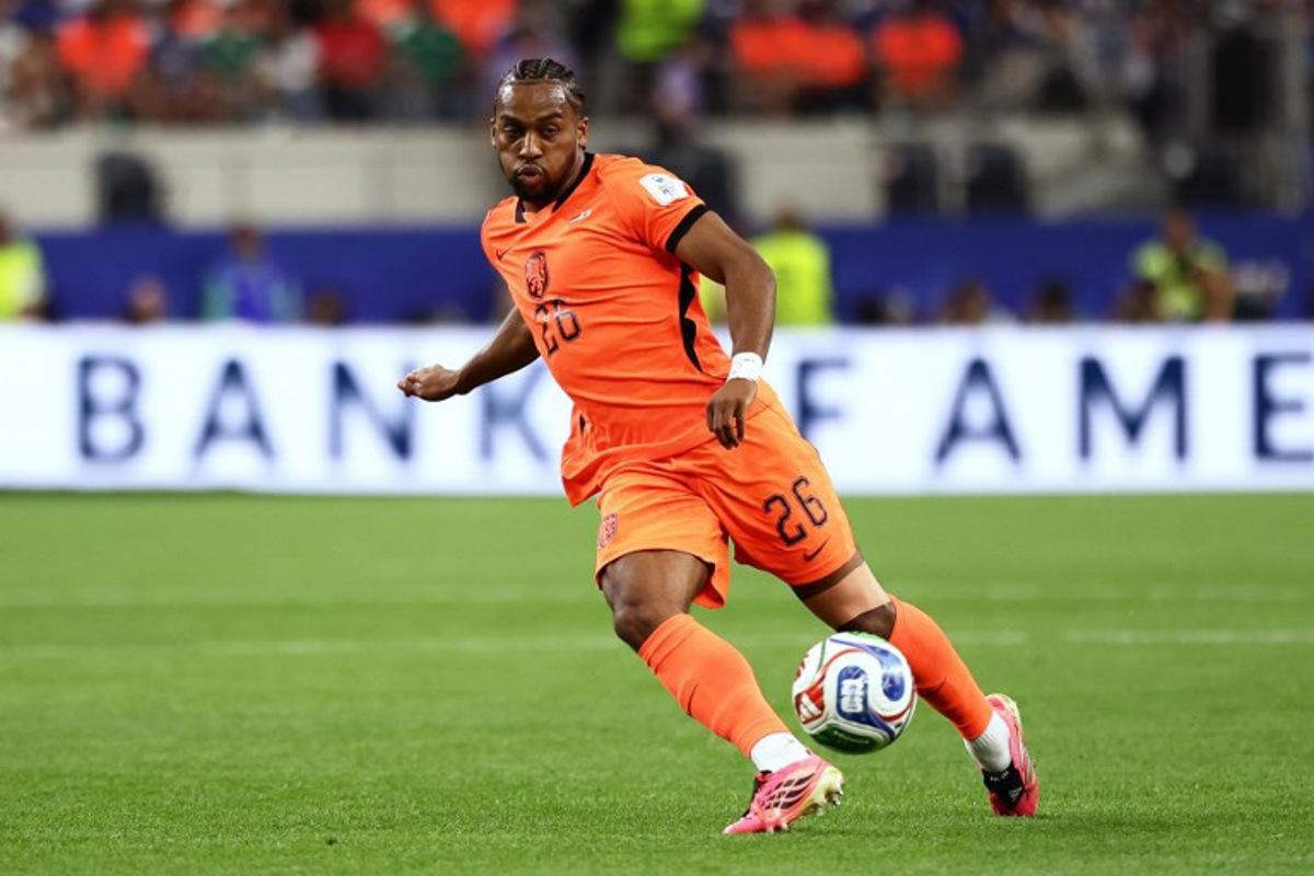 Netherlands' midfielder #26 Quinten Timber controls the ball during the 2026 World Cup Group F football match between the Netherlands and Japan at the Dallas Stadium in Arlington on June 14, 2026. Aric Becker / AFP