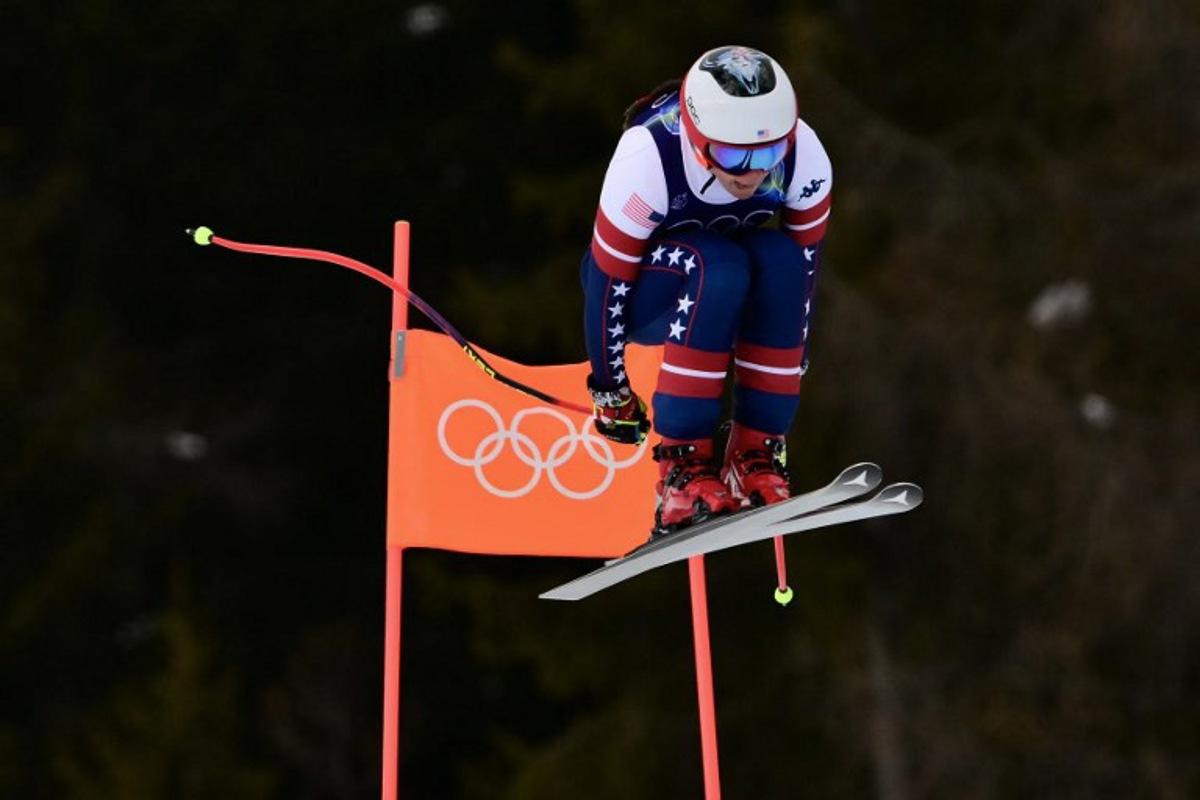 US' Breezy Johnson competes in the downhill run of the women's team combined event during the Milano Cortina 2026 Winter Olympic Games at the Tofane Alpine Skiing Centre in Cortina d'Ampezzo on February 10, 2026. Stefano RELLANDINI / AFP