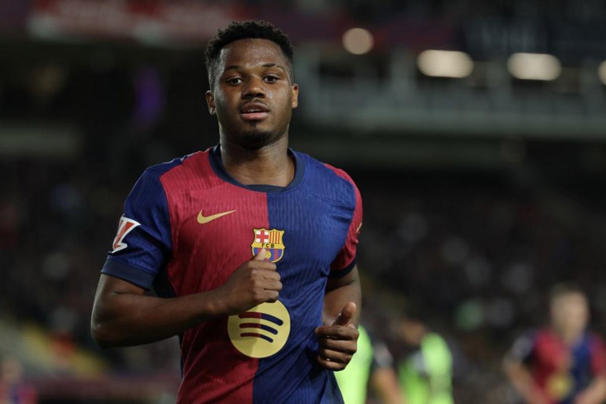 Barcelona's Spanish forward #10 Ansu Fati runs during the Spanish league football match between FC Barcelona and RCD Mallorca at the Estadi Olimpic Lluis Companys in Barcelona, on April 22, 2025. LLUIS GENE / AFP