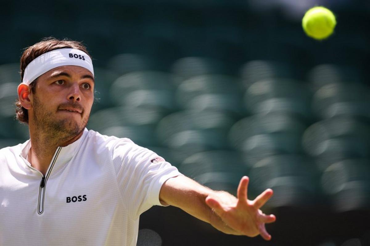 US player Taylor Fritz eyes the ball as he plays against Russia's Karen Khachanov during their men's singles quarter-final tennis match on the ninth day of the 2025 Wimbledon Championships at The All England Lawn Tennis and Croquet Club in Wimbledon, southwest London, on July 8, 2025. HENRY NICHOLLS / AFP