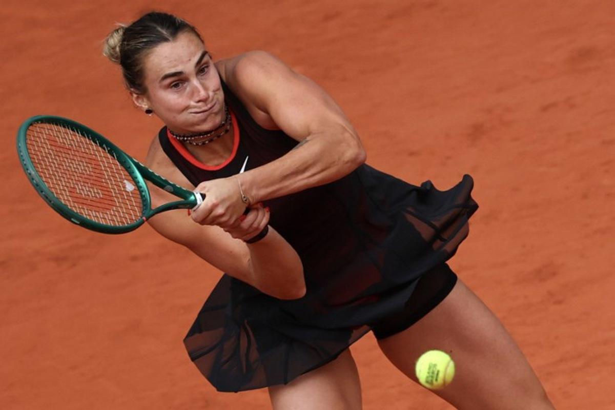 Aryna Sabalenka plays a backhand return to Diana Shnaider during their women's quarter final singles match on day 11 of the French Open tennis tournament on Court Philippe-Chatrier at the Roland-Garros Complex in Paris on June 3, 2026. Anne-Christine POUJOULAT / AFP