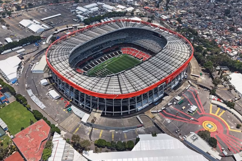 This aerial view shows the Mexico City Stadium, renamed from Azteca Stadium (or Banorte Stadium) for the FIFA World Cup, in Mexico City on May 28, 2026. FIFA temporarily branded the iconic Azteca Stadium as "Mexico City Stadium" for the 2026 World Cup, enforcing a strict "debranding" policy that requires all host stadiums to remove or cover non-official corporate sponsor names, suite branding, and external logos. Carl DE SOUZA / AFP