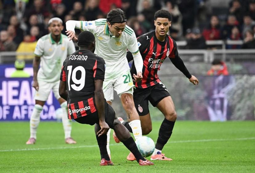 Roma's Argentine forward #21 Paulo Dybala (C) fights for the ball with AC Milan's French midfielder #19 Youssouf Fofana (L) and AC Milan's Belgian defender #05 Koni De Winter (R) during the Italian Serie A football match between AC Milan and AS Roma at San Siro stadium in Milan, on November 2, 2025.  Isabella BONOTTO / AFP