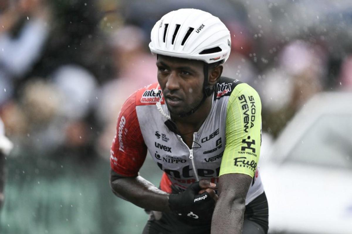 Intermarche - Wanty team's Eritrean rider Biniam Girmay crosses the finish line nursing injuries after a mass crash in the final metres of the 17th stage of the 112th edition of the Tour de France cycling race, 160.4 km between Bollene and Valence, southern France, on July 23, 2025. Marco BERTORELLO / AFP