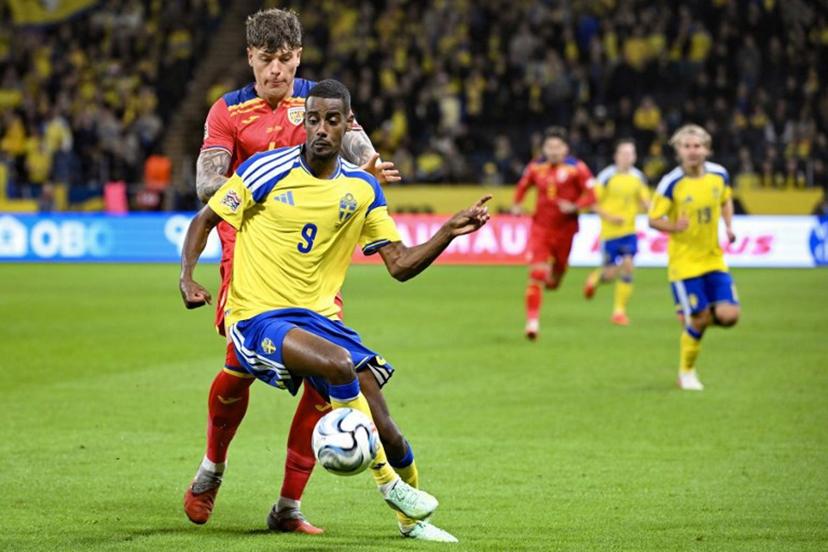 Sweden's forward #09 Alexander Isak and Romania's defender #04 Andrei Coubis vie for the ball during the UEFA Nations League Group B4 football match between Sweden and Romania in Solna, Sweden on September 25, 2026. Jonathan Nackstrand / AFP
