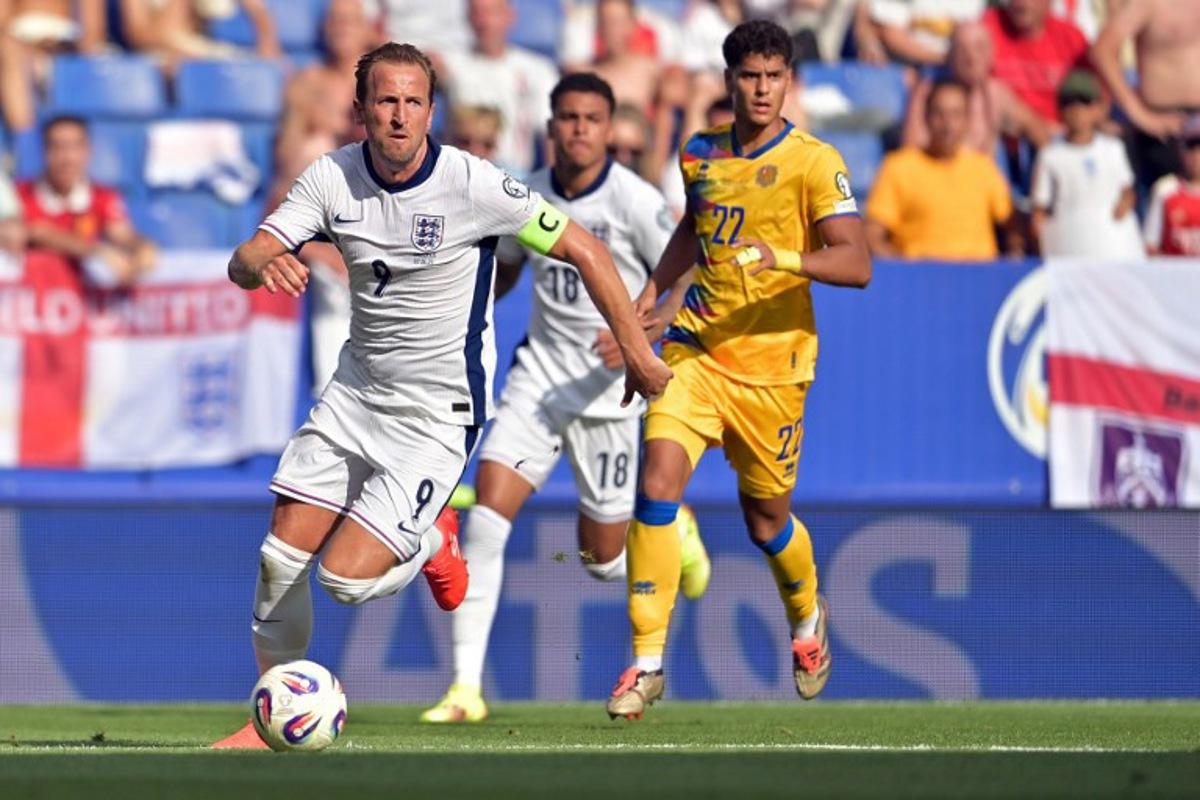 England's forward #09 Harry Kane runs with the ball during the 2026 World Cup qualifiers Europe zone, 1st round group K football match between Andorra and England at RCDE Stadium in Cornella de Llobregat, on June 7, 2025. MANAURE QUINTERO / AFP
