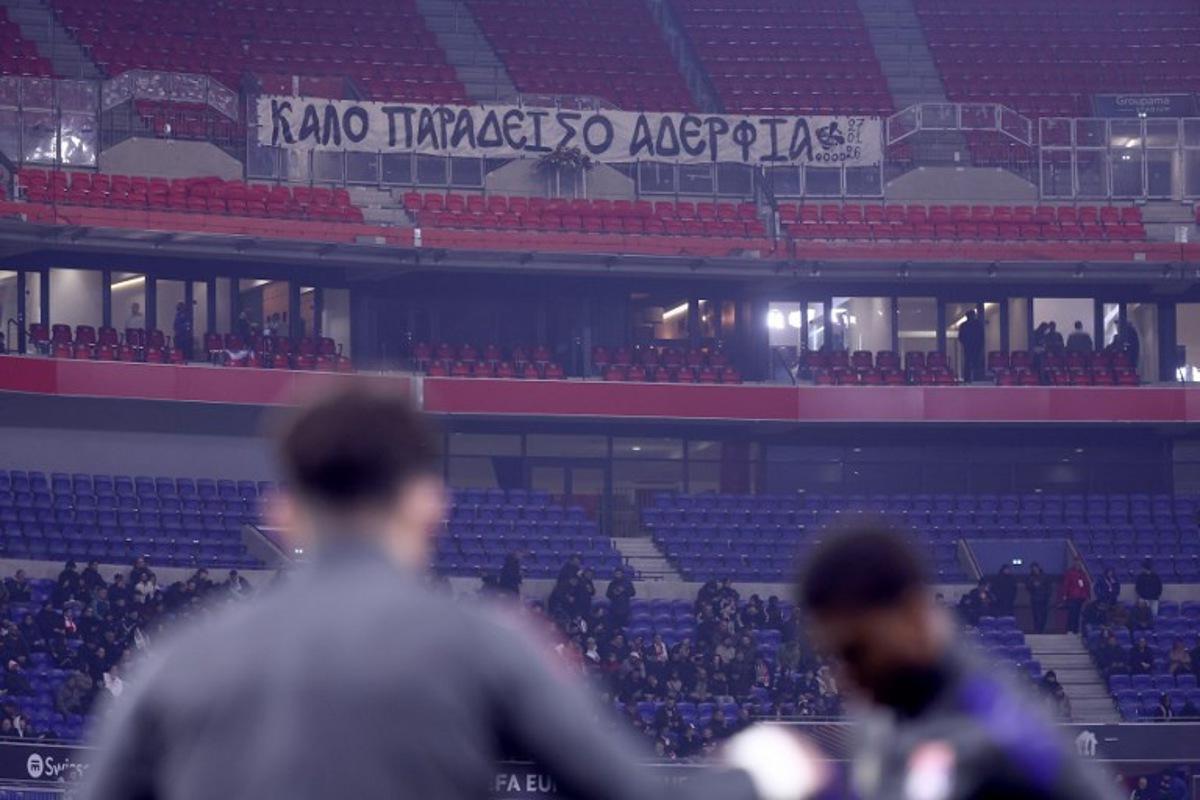 A banner paying tribute to PAOK supporters who died in an accident in Romania is displayed in the stands ahead of the UEFA Europa League - League phase, Matchday 8 - football match between Olympique Lyonnais (OL) and PAOK FC at the Groupama Stadium in Lyon, central-eastern France, on January 29, 2026. Alex MARTIN / AFP