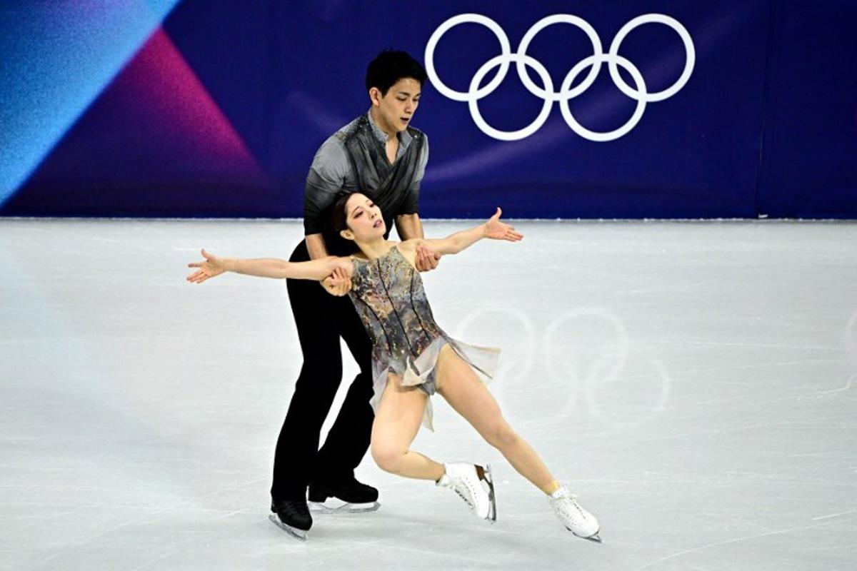 Japan's Riku Miura and Ryuichi Kihara compete in the figure skating pair skating free skating final during the Milano Cortina 2026 Winter Olympic Games at Milano Ice Skating Arena in Milan on February 16, 2026. JULIEN DE ROSA / AFP