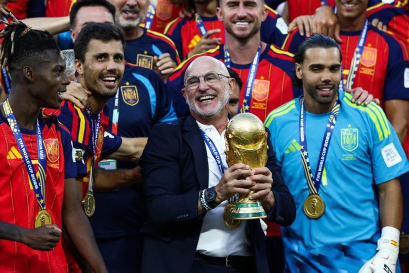 Spain's head coach Luis de la Fuente holds the trophy after winning the 2026 World Cup football tournament final match between Spain and Argentina at the New York/New Jersey Stadium in East Rutherford on July 19, 2026. FRANCK FIFE / AFP