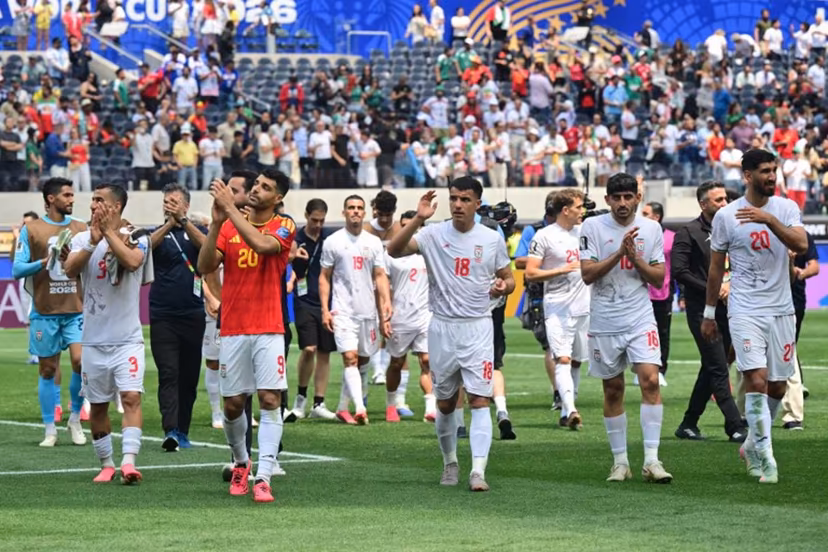Iran's players celebrate at the end of the 2026 World Cup Group G football match between Belgium and Iran at the Los Angeles Stadium in Inglewood on June 21, 2026. Frederic J. Brown / AFP