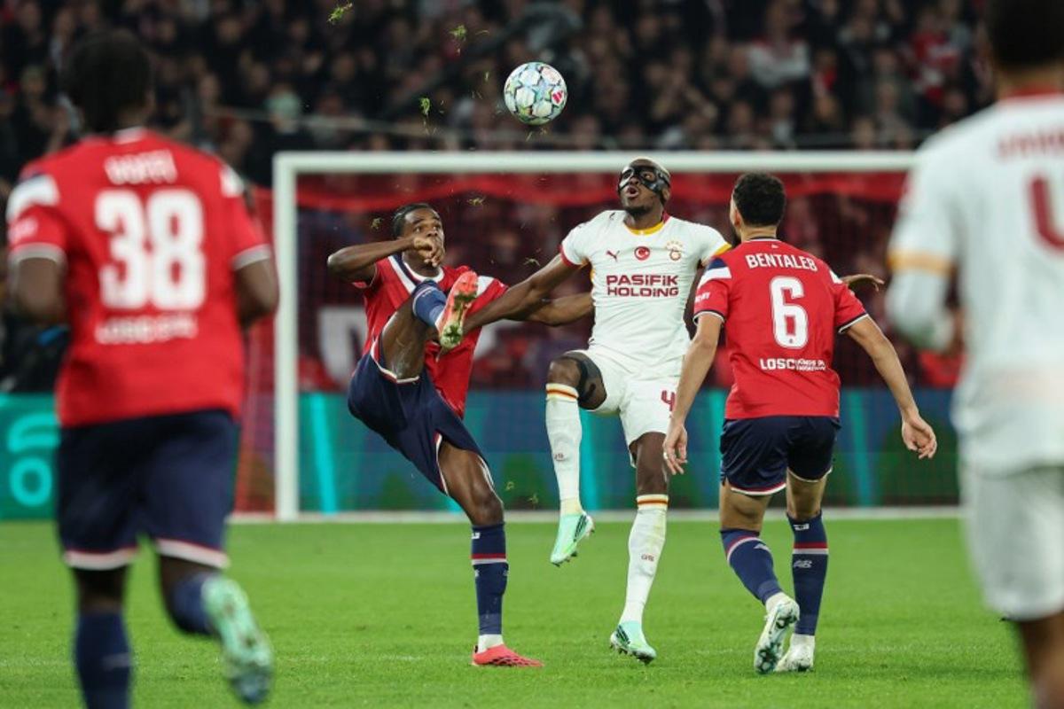 Galatasaray's Nigerian forward #45 Victor Osimhen fights for the ball with Lille's Belgian defender #03 Nathan Ngoy and Lille's Algerian midfielder #06 Nabil Bentaleb during the UEFA Champions League first round day 3 football match between Lille LOSC and Galatasaray at the Pierre Mauroy Stadium in Villeneuve-d'Ascq, northern France on October 21, 2026. Sameer AL-DOUMY / AFP