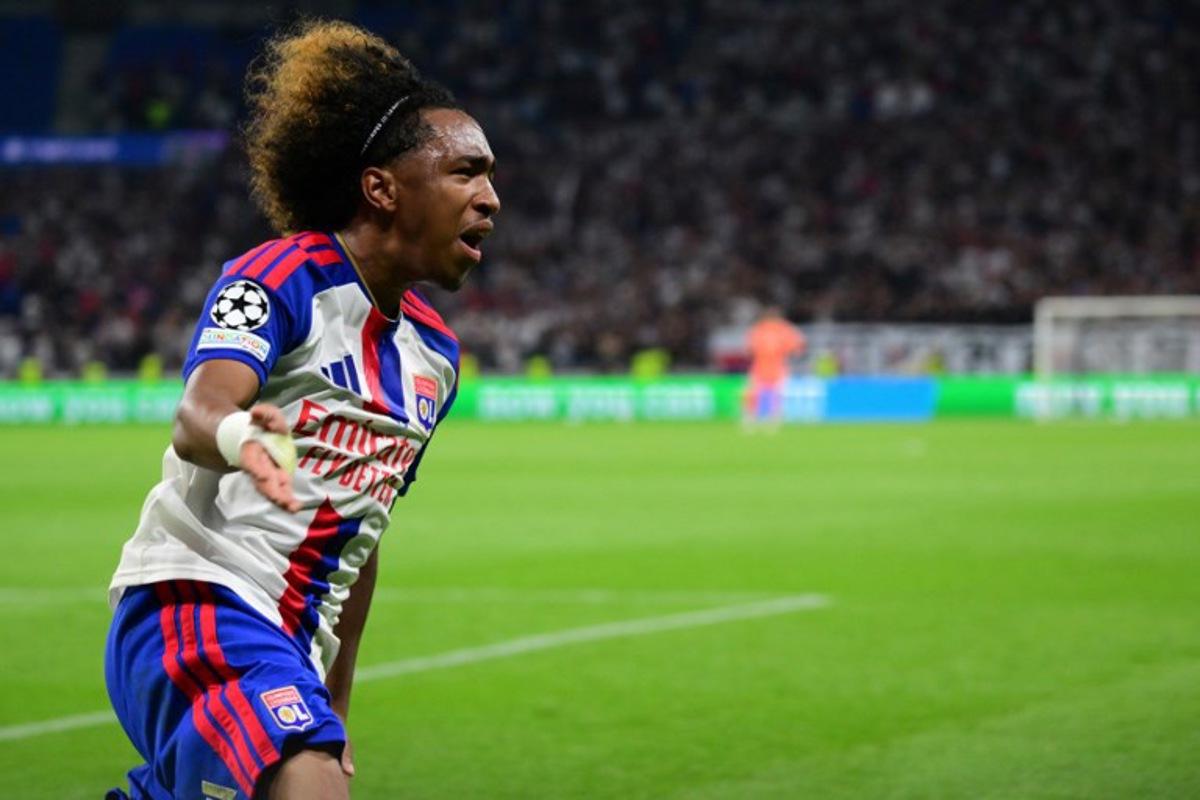 Lyon's Belgian forward #11 Malick Fofana celebrates after scoring Lyon's first goal during the UEFA Champions League qualifying playoff - second leg football match between Olympique Lyonnais (OL) and Fenerbahce SK and at the Groupama Stadium in Decines-Charpieu, central-eastern France, on August 26, 2026. Olivier CHASSIGNOLE / AFP