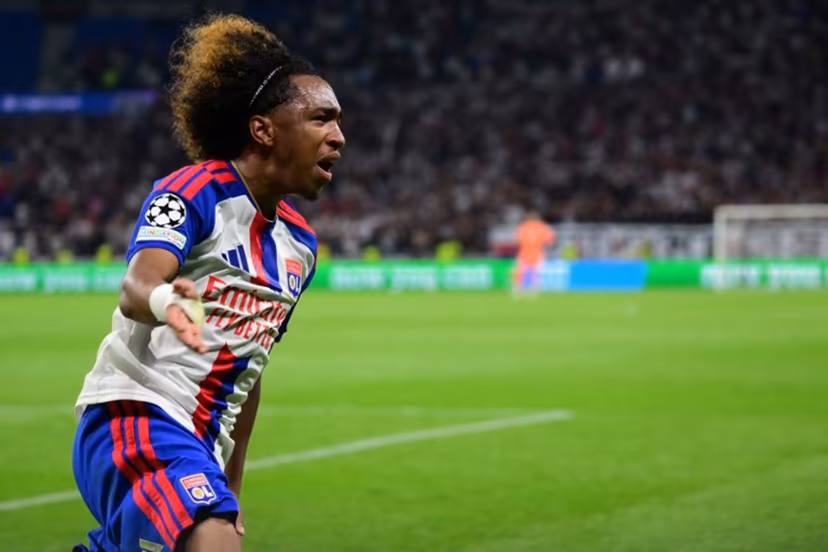 Lyon's Belgian forward #11 Malick Fofana celebrates after scoring Lyon's first goal during the UEFA Champions League qualifying playoff - second leg football match between Olympique Lyonnais (OL) and Fenerbahce SK and at the Groupama Stadium in Decines-Charpieu, central-eastern France, on August 26, 2026. Olivier CHASSIGNOLE / AFP