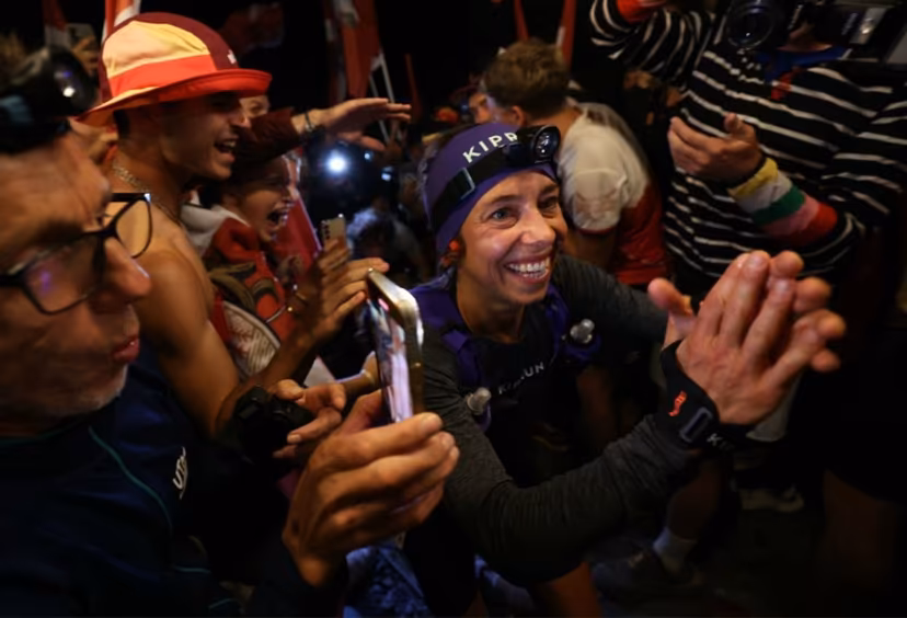 French runner Blandine L'Hirondelle is welcomed by supporters as he climbs the Notre Dame de la Gorge during the Ultra-Trail du Mont Blanc (UTMB) in Les Contamines-Montjoie on August 30, 2024. EMMANUEL DUNAND / AFP