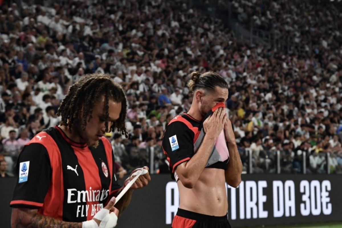 AC Milan's Belgian midfielder #22 Diego Moreira (L) and AC Milan's French midfielder #12 Adrien Rabiot react after being substitued during the Italian Serie A football match between Juventus and AC Milan at the Allianz Stadium in Turin on September 6, 2026. Isabella BONOTTO / AFP