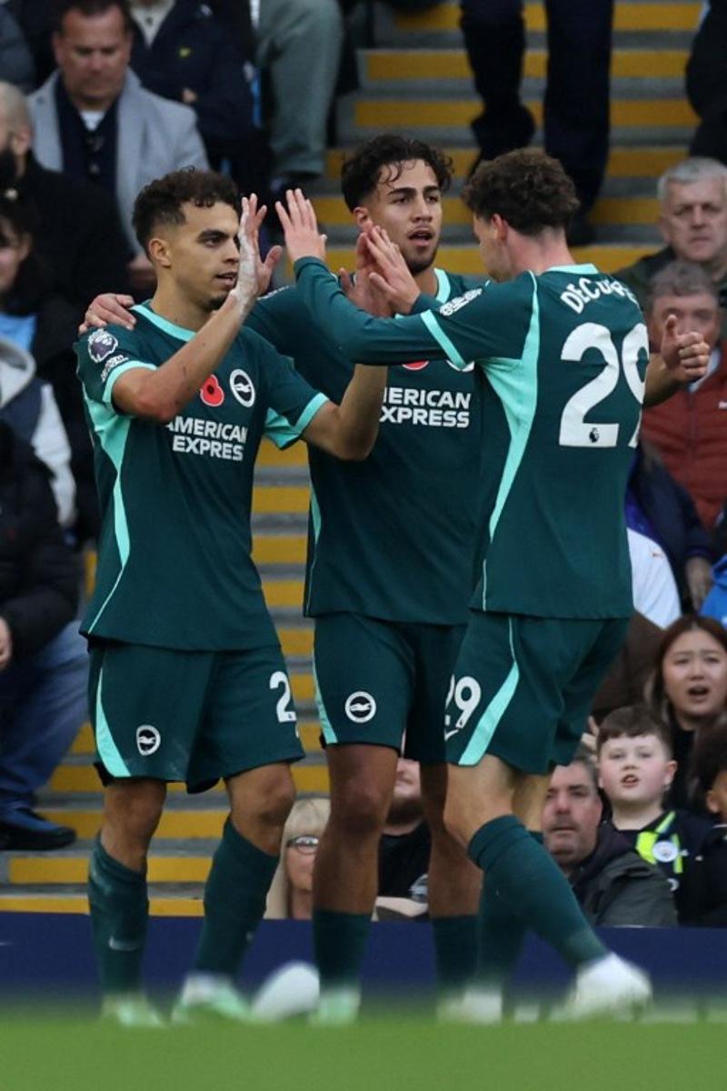 Brighton's Swedish midfielder #26 Yasin Ayari (L) celebrates scoring the team's first goal during the English Premier League football match between Manchester City and Brighton and Hove Albion at the Etihad Stadium in Manchester, north west England, on October 31, 2026. Darren Staples / AFP