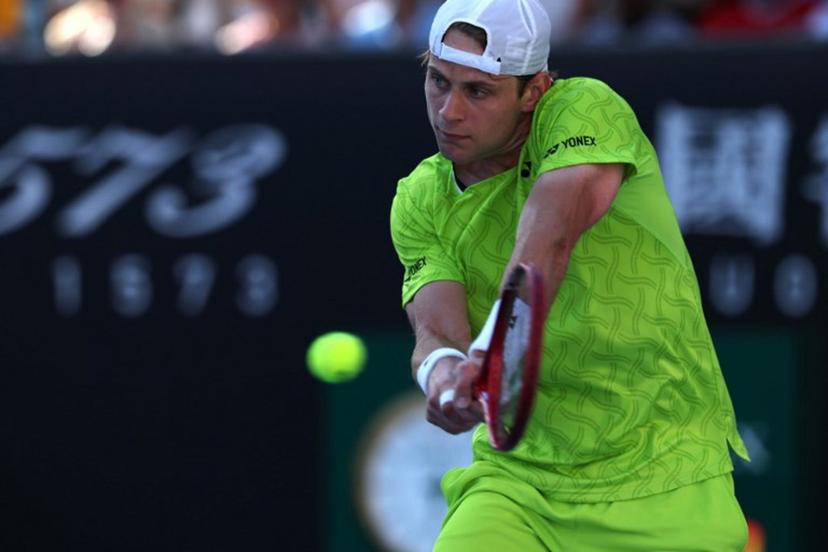 Belgium's Zizou Bergs hits a shot against Poland's Hubert Hurkacz during their men's singles match on day three of the Australian Open tennis tournament in Melbourne on January 20, 2026. IZHAR KHAN / AFP