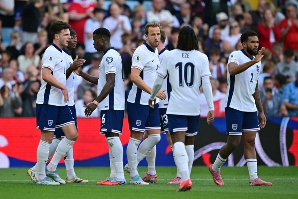 England's midfielder Declan Rice (L) celebrates after Andorra's midfielder #06 Christian Garcia scores an own goal during the 2026 World Cup Group K qualifier football match between England and Andorra, at Villa Park, in Birmingham, on September 6, 2025. Ben STANSALL / AFP