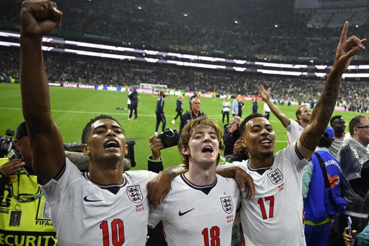 England's midfielder #10 Jude Bellingham, forward #18 Anthony Gordon and midfielder #17 Morgan Rogers celebrate after winning the 2026 World Cup round of 16 football match between Mexico and England at the Mexico City Stadium in Mexico City on July 5, 2026. Alfredo ESTRELLA / AFP