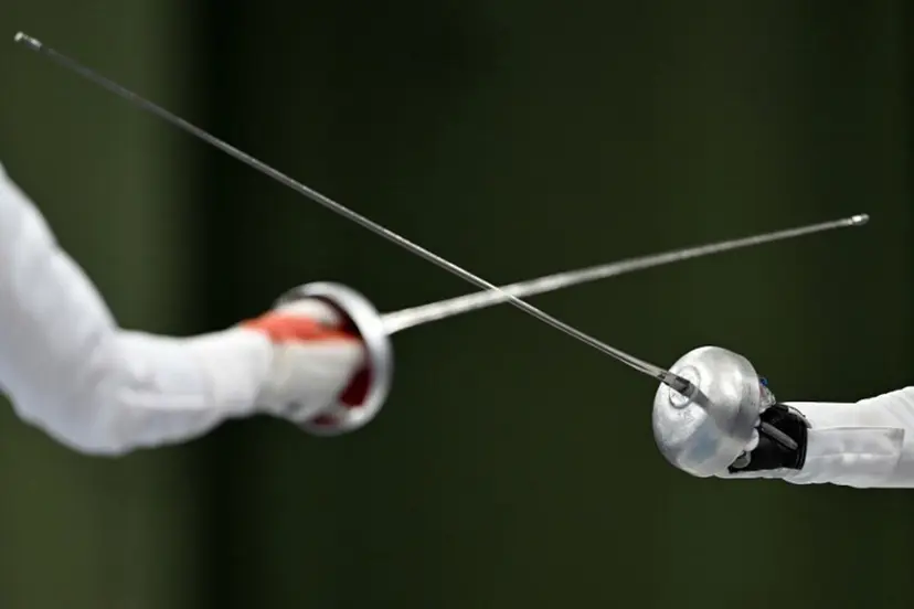 China's Tang Junyao and Italy's Alberta Santuccio compete in the women's epee team semi-final bout during the Paris 2024 Olympic Games at the Grand Palais in Paris, on July 30, 2024. Fabrice COFFRINI / AFP