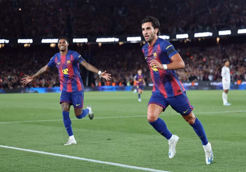 Barcelona's Spanish forward #07 Ferran Torres (R) celebrates scoring his team's second goal with Barcelona's English forward #14 Marcus Rashford during the Spanish league football match between FC Barcelona and Real Madrid CF at Camp Nou Stadium in Barcelona on May 10, 2026. Josep LAGO / AFP