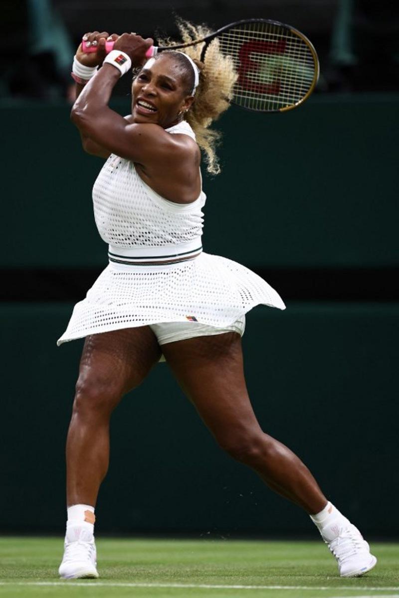 US player Serena Williams returns the ball to Australia's Maya Joint during their women's singles first round tennis match on the second day of the 2026 Wimbledon Championships at The All England Lawn Tennis and Croquet Club in Wimbledon, southwest London, on June 30, 2026. HENRY NICHOLLS / AFP