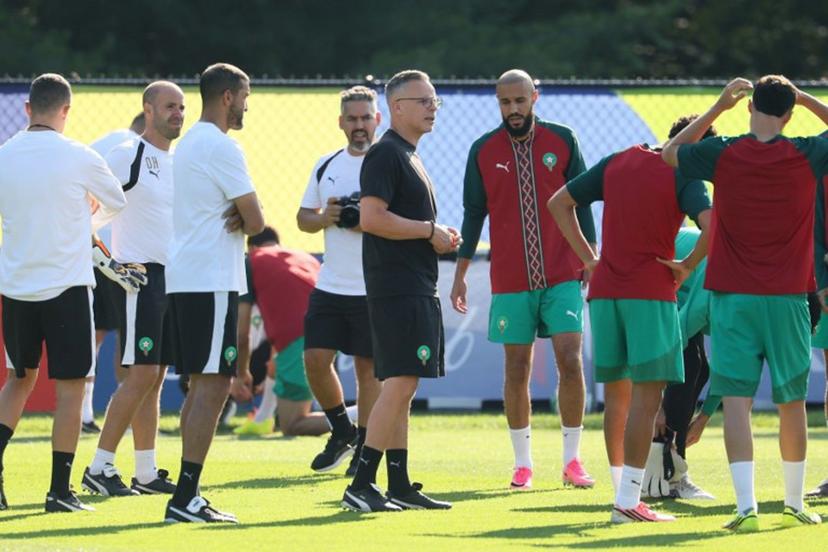 Morocco's head coach Mohamed Ouahbi (C) speaks to his players in an MD-1 training session at New England Revolution Training Centre in Foxborough, near Boston, on July 8, 2026, on the eve of the 2026 World Cup football tournament quarter-final match between France and Morocco. Odd ANDERSEN / AFP