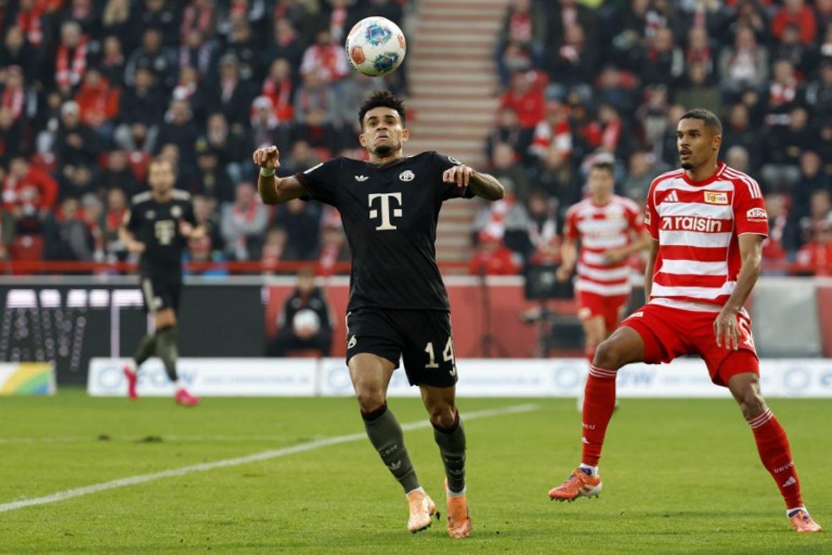 Bayern Munich's Colombian forward #14 Luis Diaz (L) controls the ball during the German first division Bundesliga football match between 1 FC Union Berlin and FC Bayern Munich in Berlin on November 8, 2025. Odd ANDERSEN / AFP