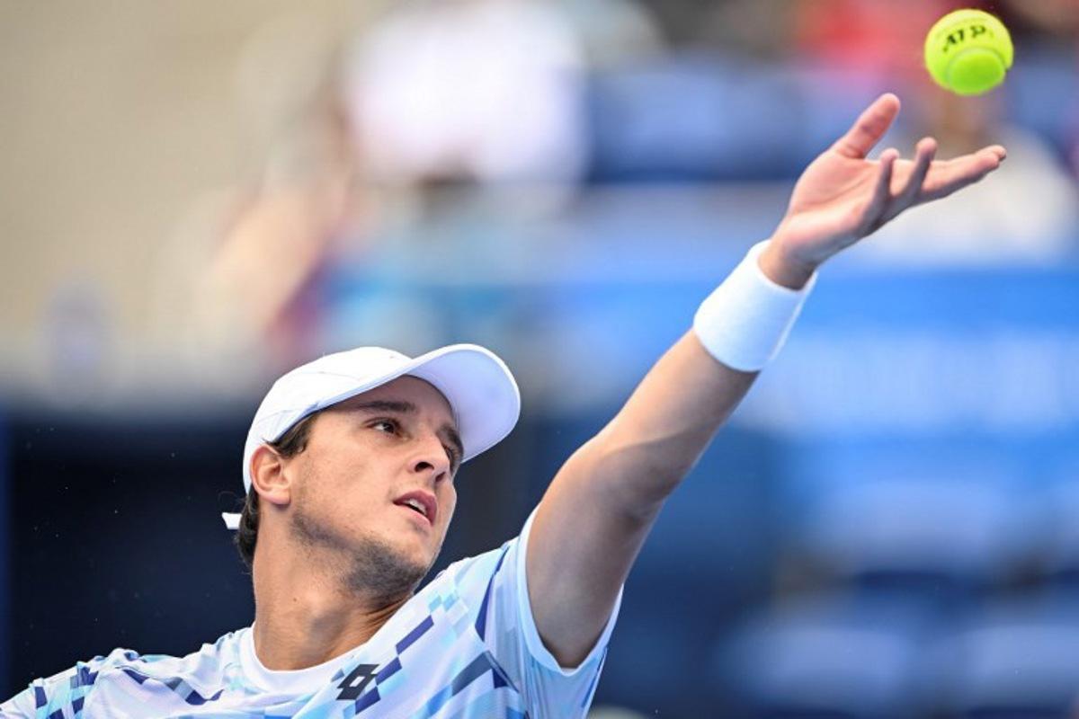 Italy's Luciano Darderi serves to Argentina's Mariano Navone during their men's singles match at the Japan Open tennis tournament at Ariake Coliseum in Tokyo on September 25, 2024. Yuichi YAMAZAKI / AFP