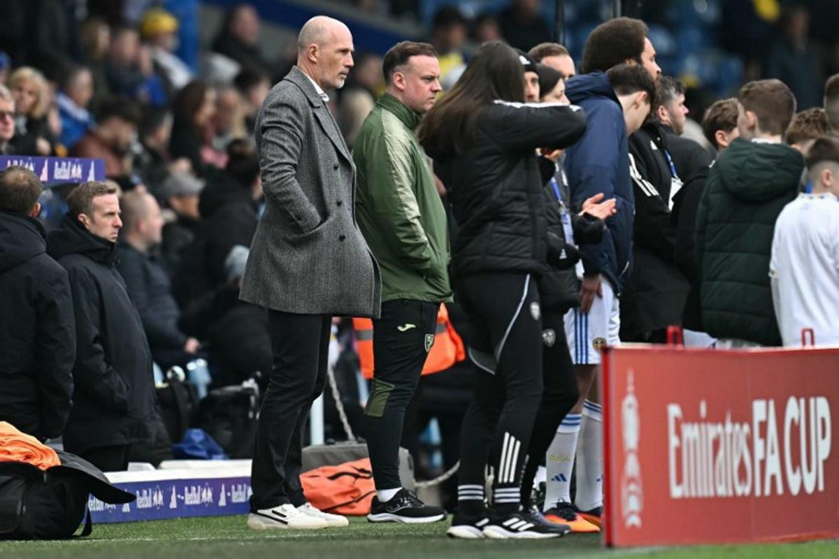 Norwich City's Belgian head coach Philippe Clement (L) looks on ahead of the English FA Cup fifth round football match between Leeds United and Norwich City at Elland Road in Leeds, northern England on March 8, 2026. Paul ELLIS / AFP