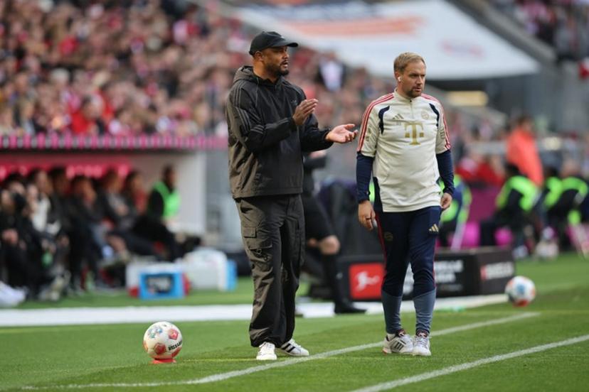 Bayern Munich's Belgian head coach Vincent Kompany (L) and FC Bayern Munich's English assistant coach Aaron Danks are seen on the sidelines during the German first division Bundesliga football match between FC Bayern Munich and FC Cologne in Munich, southern Germany, on May 16, 2026. Alexandra BEIER / AFP