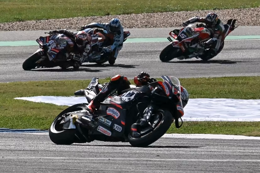 Aprilia Racing's Italian rider Marco Bezzecchi (C) competes during the MotoGP Thailand Grand Prix at the Buriram International Circuit in Buriram on March 1, 2026. Lillian SUWANRUMPHA / AFP