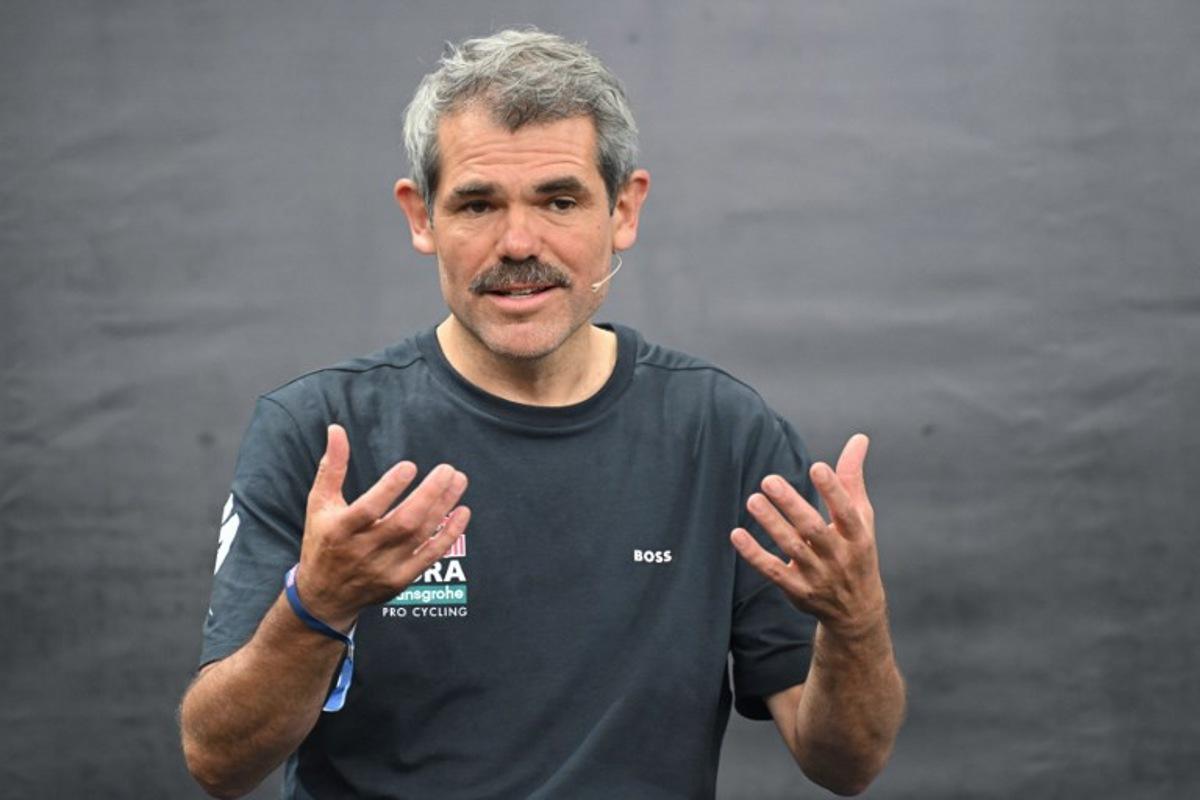 Ralph Denk, team manager, speaks during the presentation of the new Red Bull-Bora-Hansgrohe cycling team in Salzburg, Austria, on June 26, 2024. Red Bull on June 26, 2024 unveiled its eight-rider cycling team to debut in this week's Tour de France, marking the energy drink maker's latest expansion of its sports empire. Earlier this year, Red Bull bought a controlling stake in the German Bora-Hansgrohe cycling team. KERSTIN JOENSSON / AFP